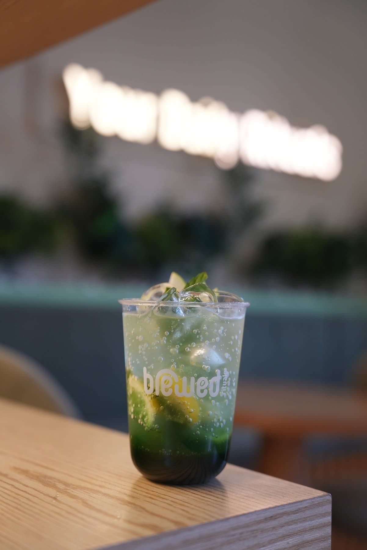An iced mint mojito in a Brewed Rituals to-go cup